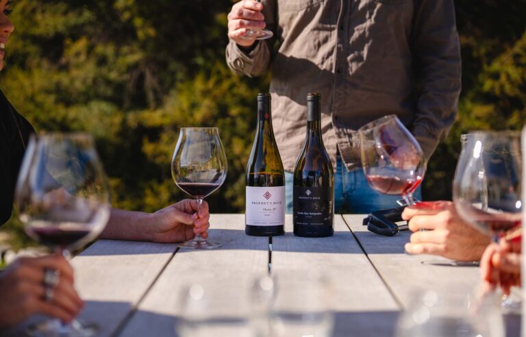 Guests tasting Prophet's Rock wines at an outdoor table